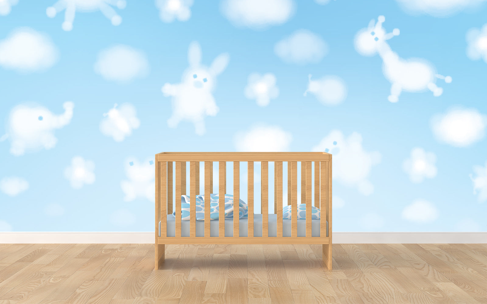 In the mural behind a crib on hardwood floor, animal-shaped clouds float through a pale blue sky.
